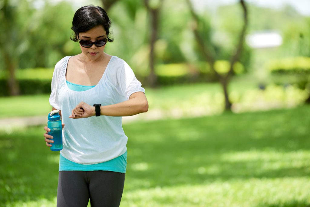 Woman Checking Fitness Wristband