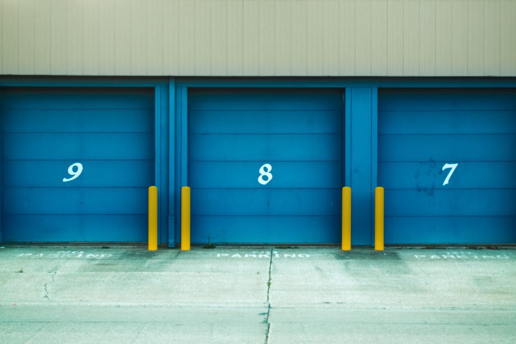 Three blue storage units with numbers on them