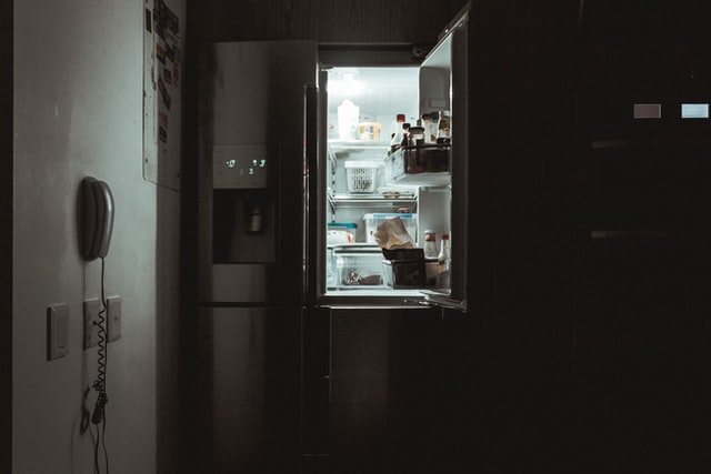 An open side-by-side refrigerator